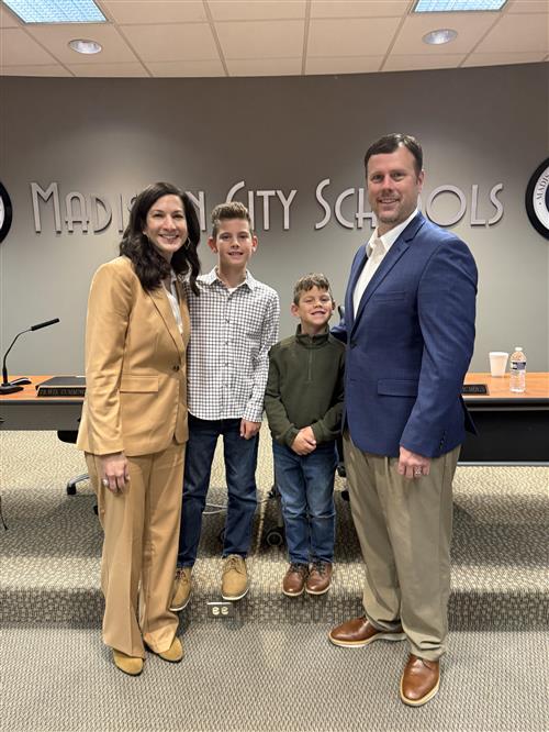 Tess Halbrooks with husband and two sons